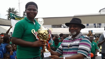 Tom Ogboi, the chairman, Board of Management of St. Saviour’s School, Ebute-Metta, Lagos State, to captain of the Green House, over all winners of the 21st Inter-House sports competition.
